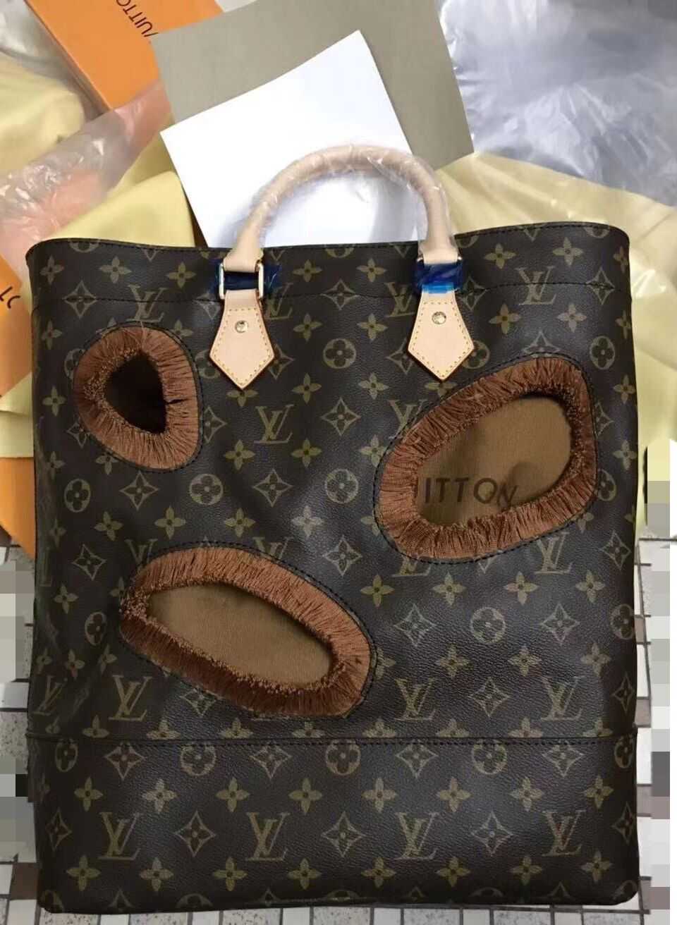 Louis Vuitton Outlet Monogram canvas BAG WITH HOLES REI KAWAKUBO M40279