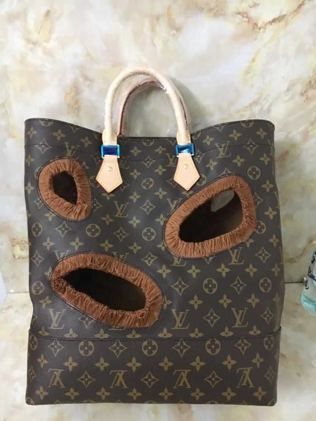 Louis Vuitton Outlet Monogram canvas BAG WITH HOLES REI KAWAKUBO M40279