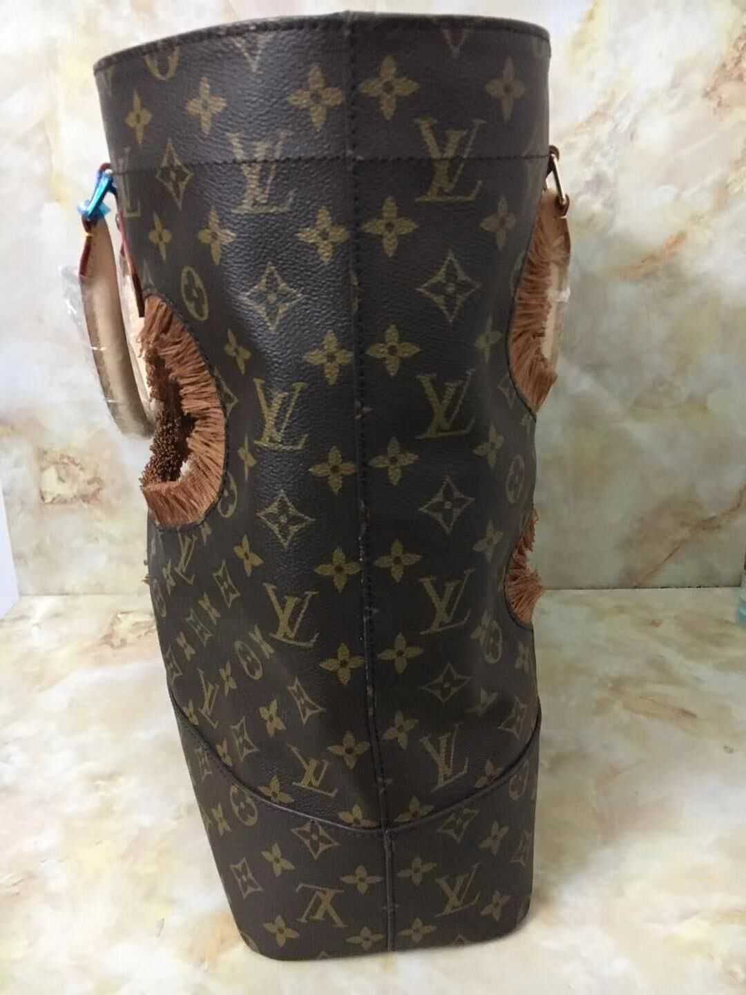 Louis Vuitton Outlet Monogram canvas BAG WITH HOLES REI KAWAKUBO M40279